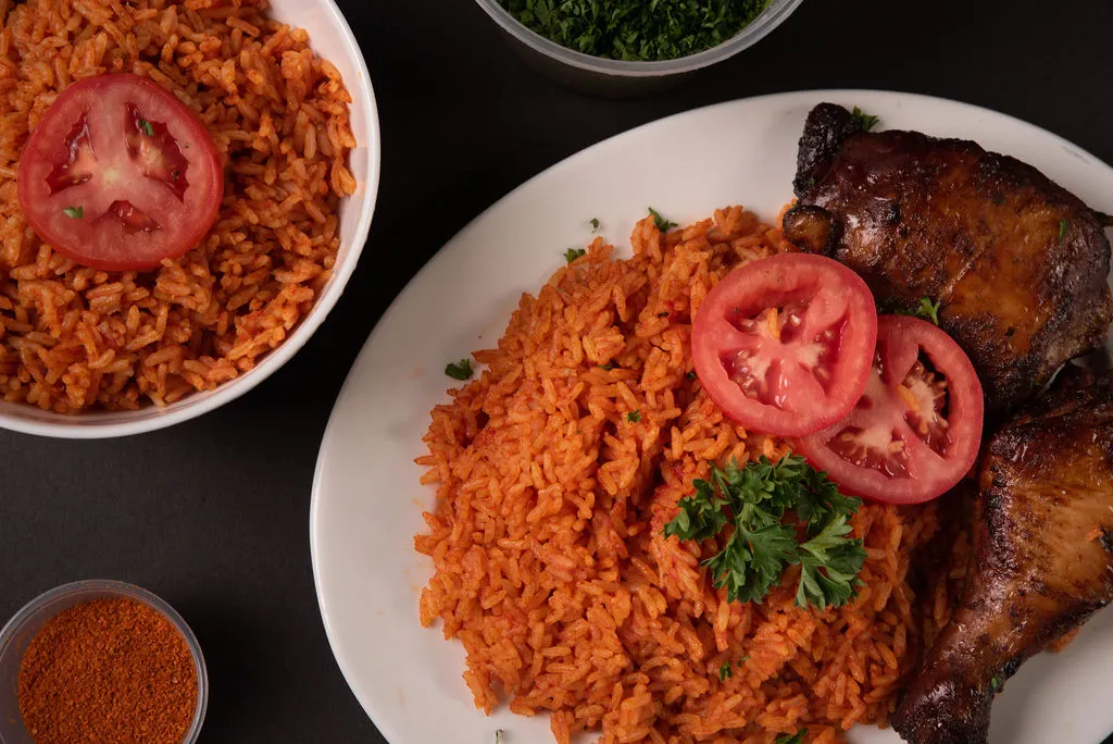 Nigerian jollof rice with grilled chicken at Global Pot Fusion Cuisine - African restaurant on Pembina Highway in Winnipeg, MB
